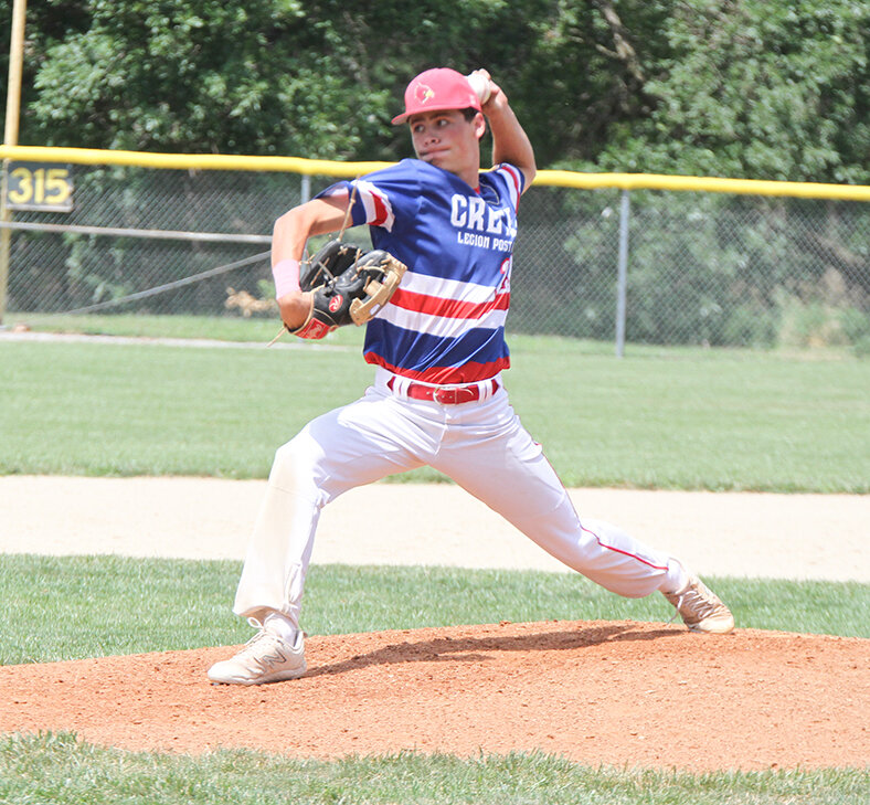 Triston Lenhoff of Crete delivers a pitch against Wilber June 30.
