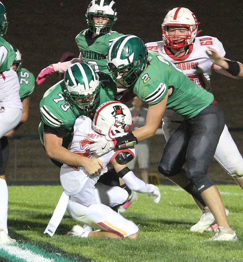 Caden Parham (73) and Cooper Palmer (2) of Wilber-Clatonia join forces to take down the Fairbury ballcarrier Oct. 4.