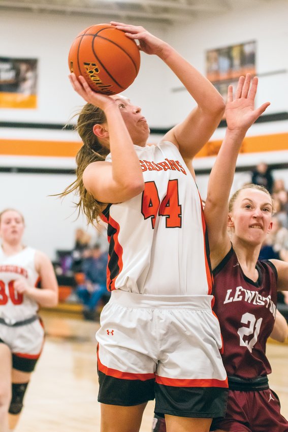 Dorchester junior Amber Kotas draws the foul from Lewiston as she sinks a layup on Dec. 29 at home.