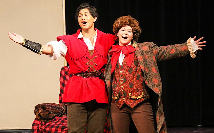 Gaston, played by Miguel Alacron, left, and Lefou, played by Le Nelson, perform the song, &quot;Gaston&quot; during the musical's dress rehearsal on March 15.