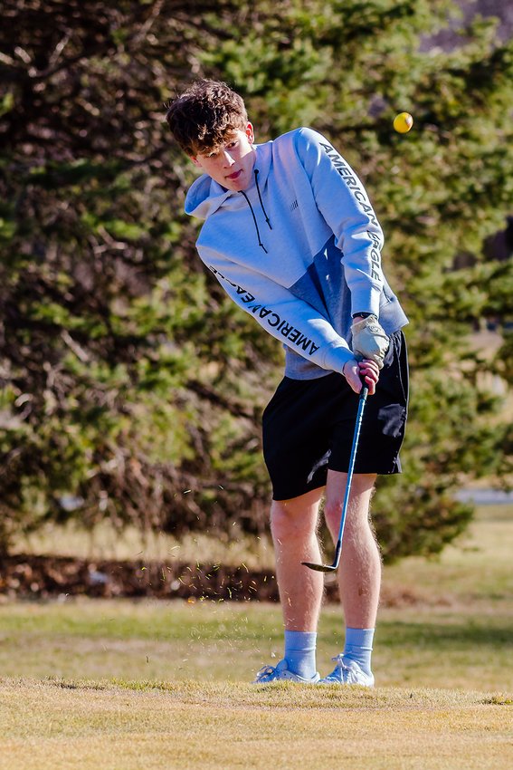 Sophomore Toryn Siske of the Crete High School golf team practices at College Heights Golf Course in Crete on March 20. College Heights partners with the high school and Doane to offer a space for students to learn the game.