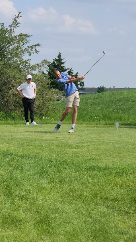 Carter Milton of Exeter-Milligan tees off during the Class D state golf tournament May 23 and 24 in North Platte.