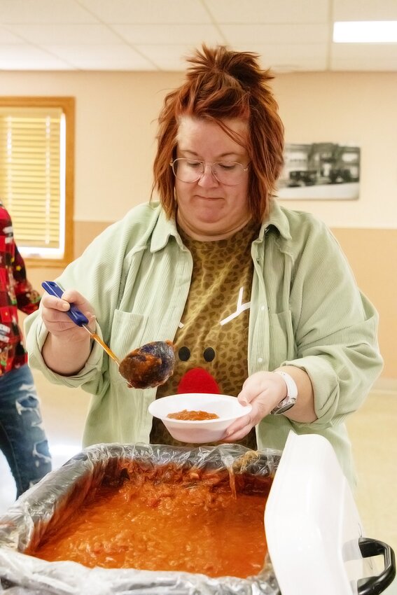 Crystal Karpisek dishes up chili at the Clatonia Craft affair on Dec. 9 at the Clatonia Community Building. The  Wilber-Clatonia Junior Class Post Prom committee is fundraising for post-prom expenses and athletic banners.