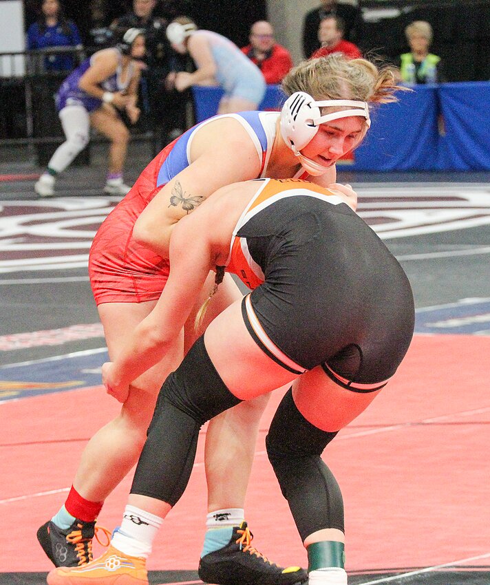 Crete's Ashaya Steele works on a takedown during her first match at state Feb. 15.