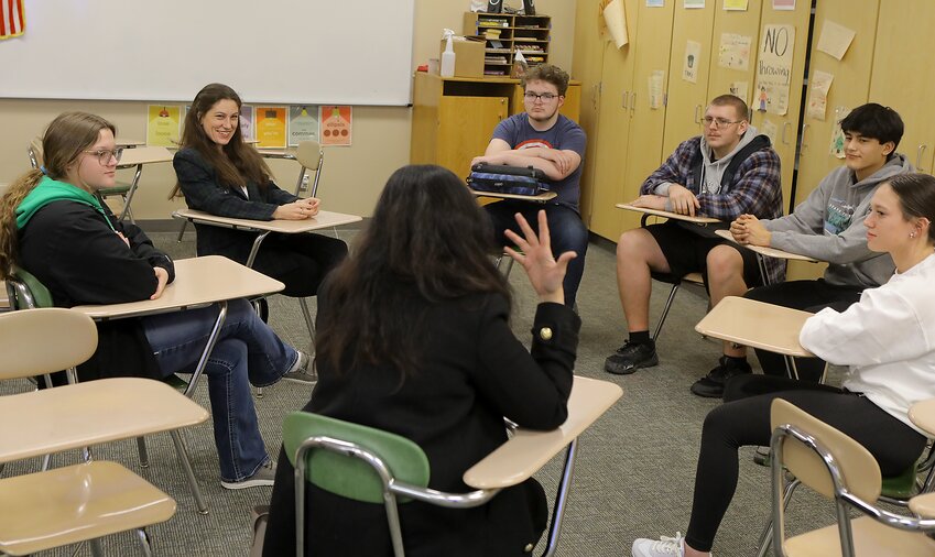 Eva Decroix second from the left and a member of parliament in the Czech Republic visits with Wilber-Clatonia students Feb. 19 during a visit to the school by an international delegation.