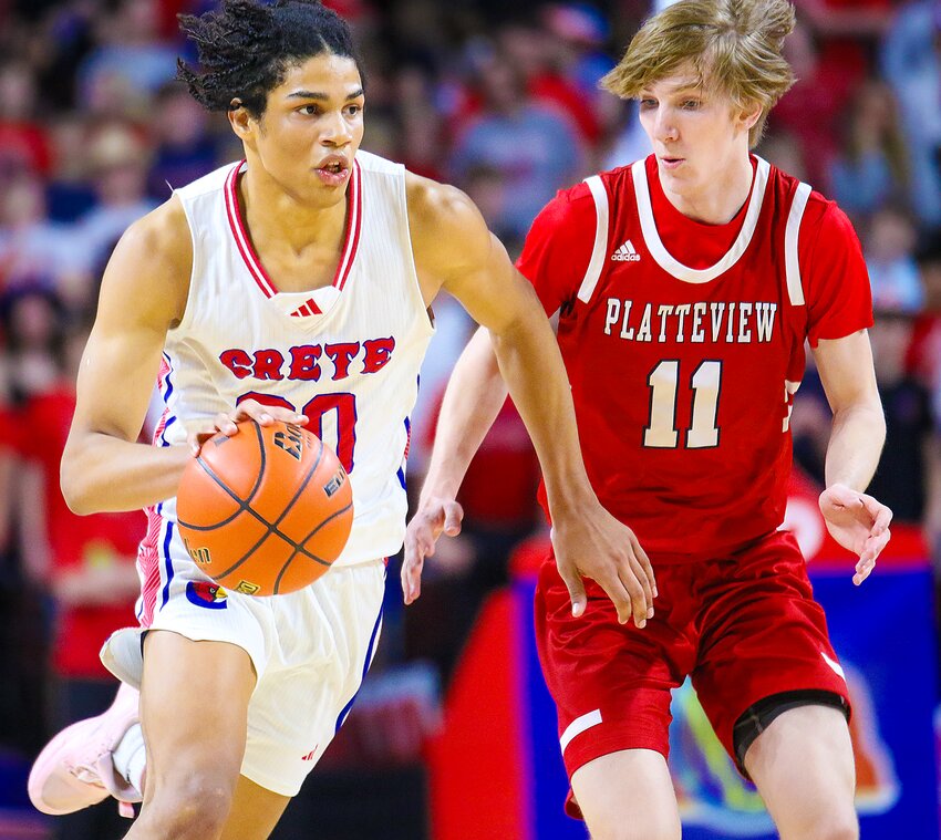 Justus Gardiner of Crete battles with Platteview's Jaxon Adams as he drives down the court during the first round of the boys Class B state basketball tournament on March 7.