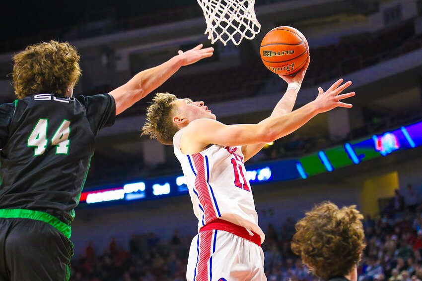 Aidan McDowell of Crete goes for a reverse layup against Omaha Skutt Catholic on March 8.