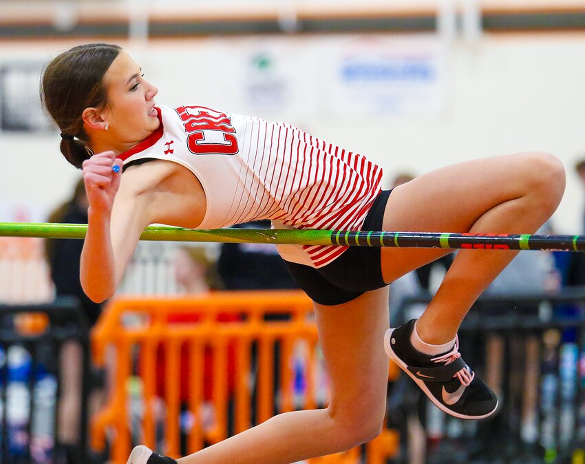 Allison McDowell of Crete attempts to clear the bar during the girls high jump on March 16.
