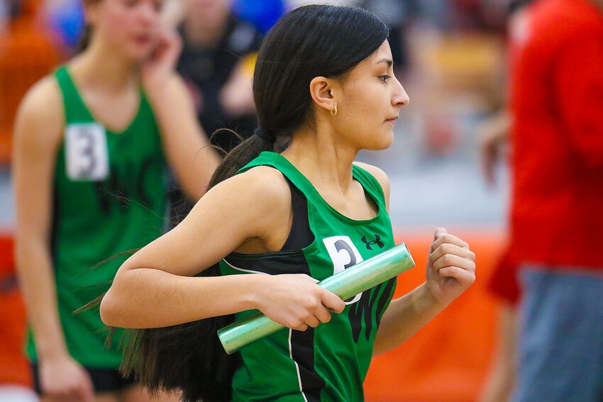 Brittany Torres of WC picks up her pace as she goes to complete her final lap of the 4X800m relay at Doane.