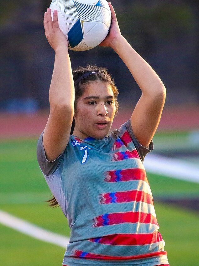 Melanie Flores of Crete looks for an open teammate to throw the ball into against Lincoln Northwest on March 21.