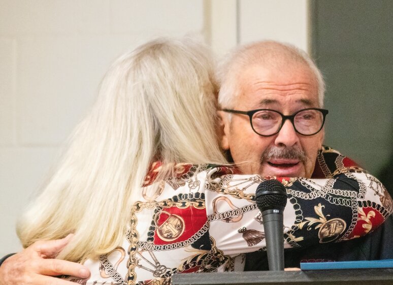 Paula Buchanan, sister of James Buchanan, embraces Terry Petracek in a hug on April 21 during the open house honoring Petracek’s 50 years of service to the Crete Volunteer Fire and Rescue Department. Petracek dedicated his years of service to James Buchanan, a close friend whose death moved Petracek to find his calling and join the department.