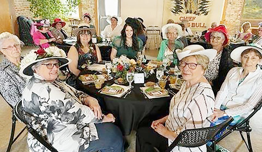 Sandy Milton, Virginia Bode, Sharla Dineen, Amanda Votipka, Judy Dineen, Jane Drake, Judy Williams and Judy Shutts [starting from the left, front 7 o’clock position] chat at the table at a past Kentucky Derby event.