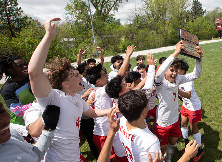 Members of the Crete High boys soccer team celebrate their 3-1 district final victory over Omaha Roncalli May 4 that earned them a berth in this week's state soccer tournament.