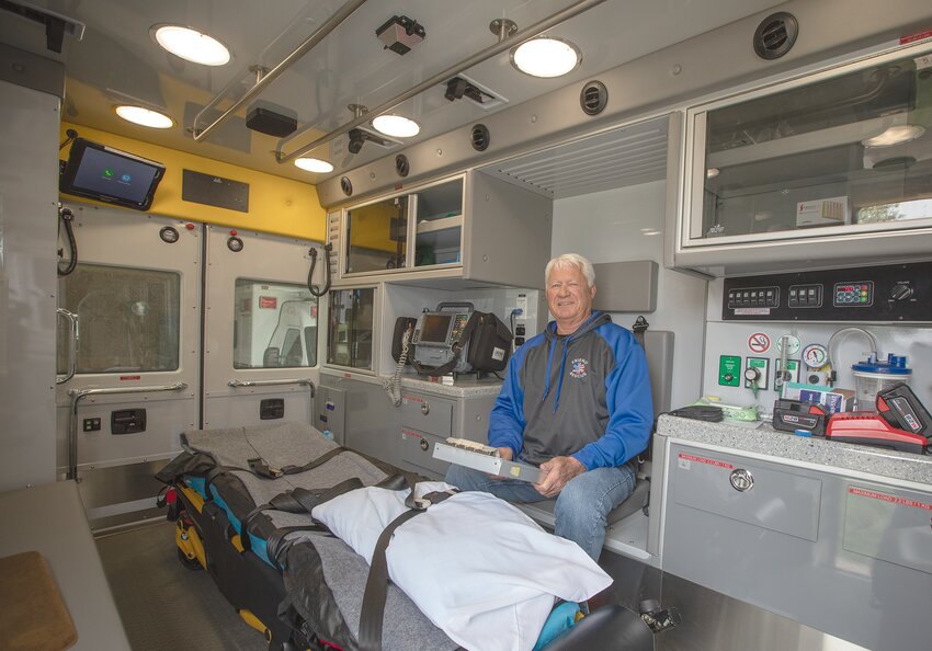 Friend rescue volunteer Ray Rohrig poses in the town ambulance that is now equipped with a telemedicine technology called Avel eCare which helps EMTs give a higher level of care on the scene of an incident and while en route to a hospital.