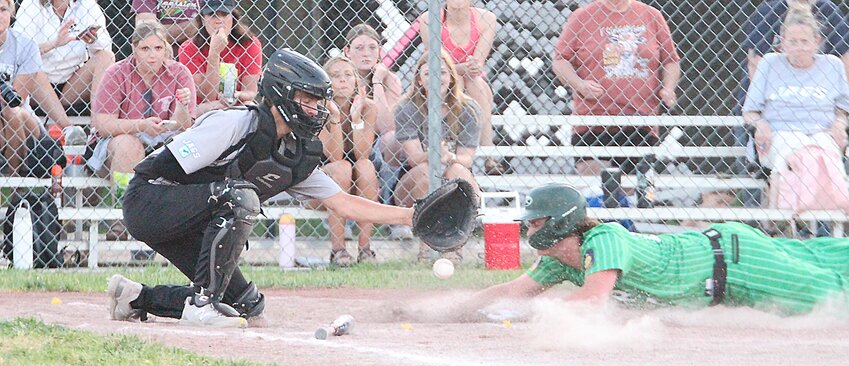 Jacob Weber of Friend makes sure Wilber's Caden Parham doesn't stray far from second base June 12.
