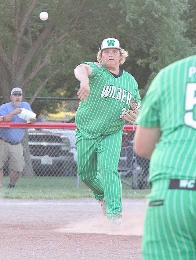 Jack Zimmerman of Wilber flips to first during June 12's game against Friend.