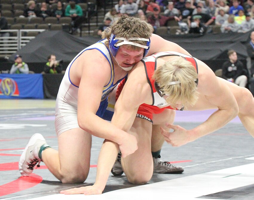 Riley Kopf of Tri County (right) works for an opening against Trevis Halsey of Elkhorn Valley.