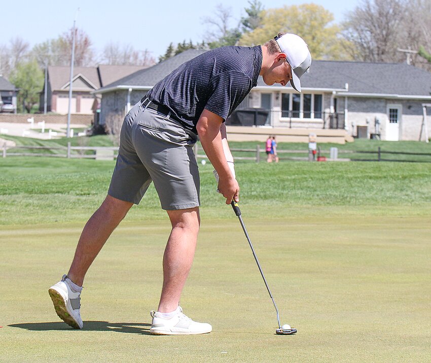 Mikey Bartu of EMF watches his ball roll toward the hole at Milford April 16.