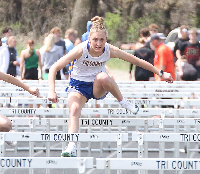 Tri County sprinters Ben Holsing, left, and Pierce Damrow, focus on the finish line in the 100-meter dash prelim April 22.
