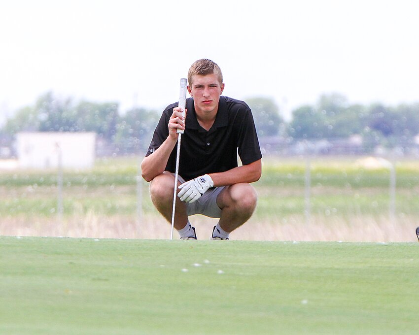 Aidan Vavra of EMF putts off the fringe on No. 18 May 29 during the state golf tournament.