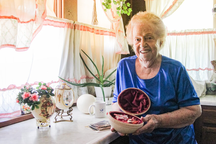 Naomi Parrish shows some of the crafts she made from ostrich eggs. Parrish and her husband had an ostrich farm in Crete for five years near Crete High School.