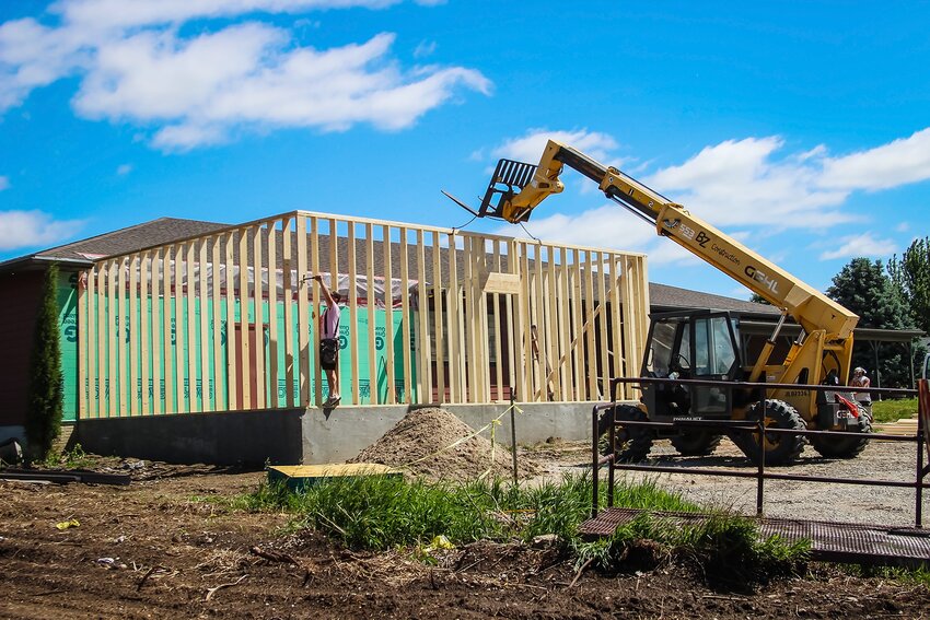 BZ Construction of Dorchester works on framing the addition to the Benne Museum on May 22.