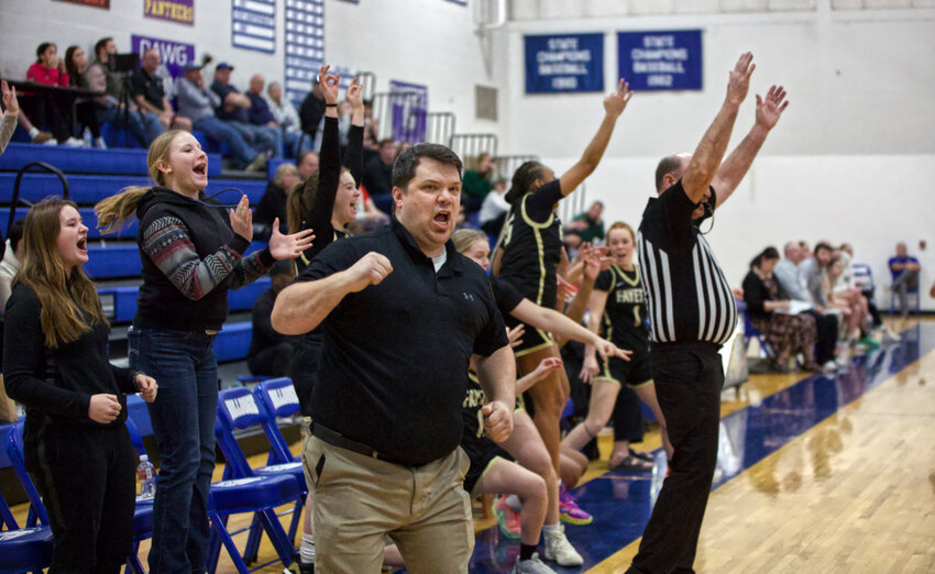 Coach Daryl Betts adn the Fayette sideline erupts after another big second-half 3-pointer.