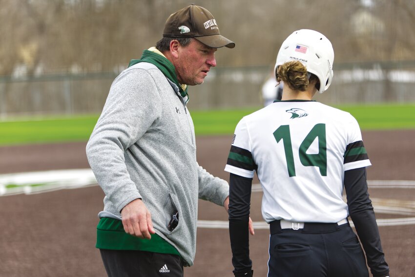 Central Methodist coach Pat Reardon discusses hitting strategy with senior Kelena Oots during a game in February.
