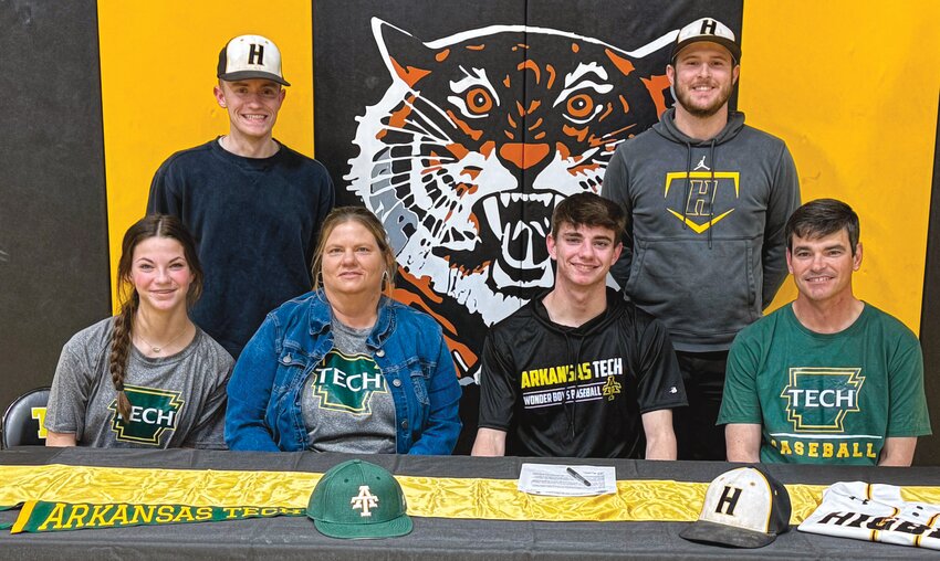 Derek Rockett signed a letter of intent to play baseball at NCAA DII Arkansas Tech on Thursday. Seated left to right: Kiersten, Morgan, Derek, and Jamie Rockett. Standing: Higbee assistant coach Seth Kirby and head coach Ryan Vogelgesang.