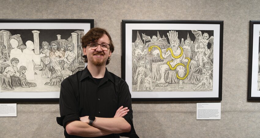 Ashby-Hodge Gallery of American Art curator Tyler Pierson with original artwork inspired by Dante’s Inferno.
