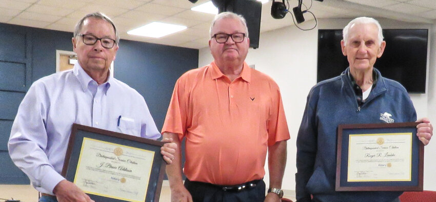 Fayette Rotary Club President Greg Stidham (center) presented framed certificates to longtime members Bruce Addison (left) and Roger Lembke (right).