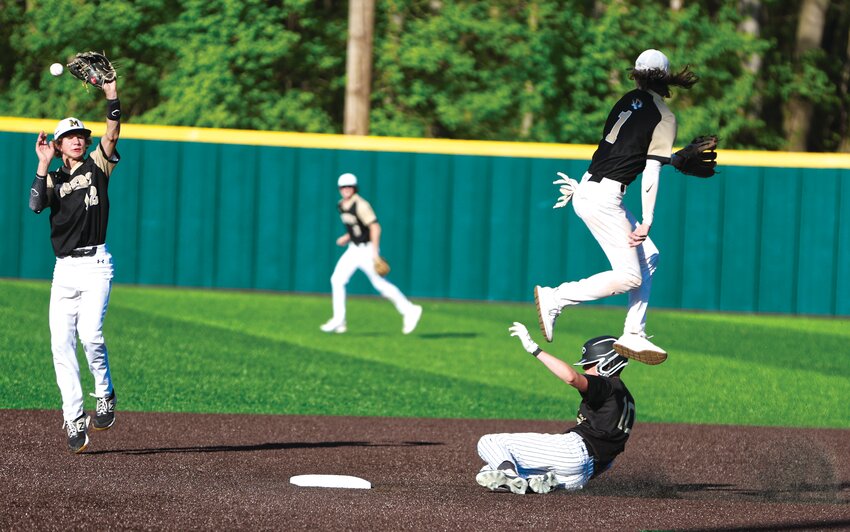 Fayette sophomore Parker LaValley steals second base after the throw sailed over two defenders.
