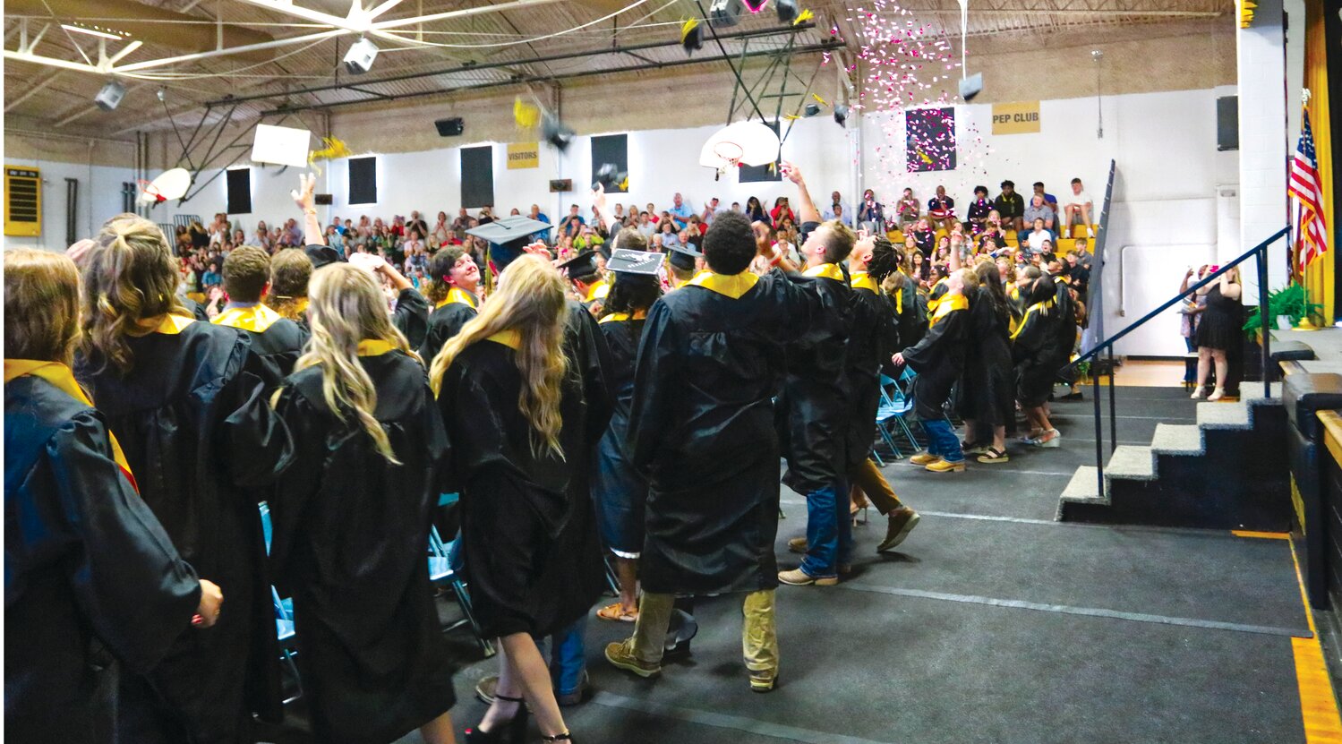 The Fayette High School Class of 2023 tosses their graduation caps into the air in celebration Sunday afternoon.