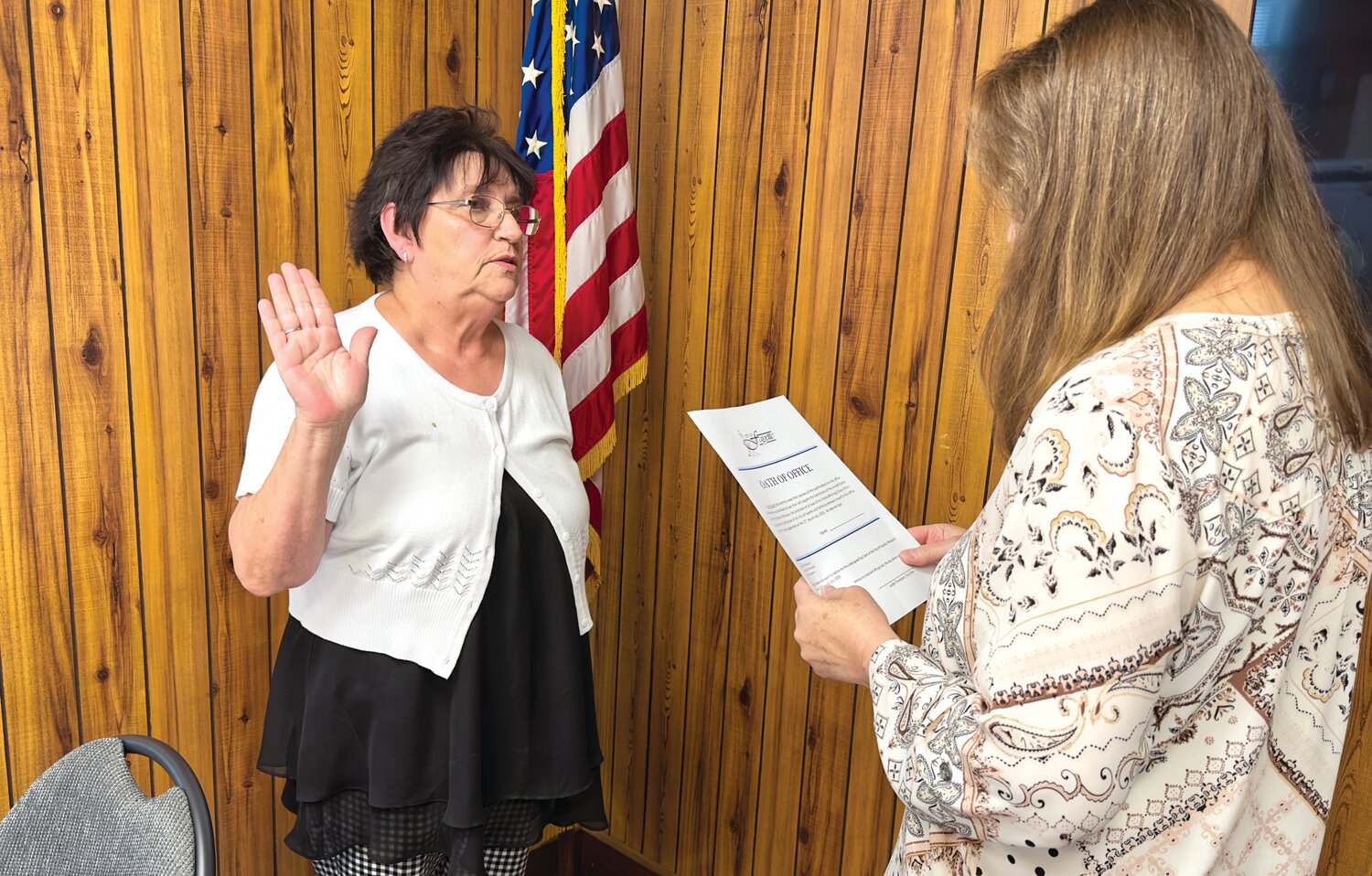 Ronda Gerlt is sworn-in as East Ward Alderwoman last week by Fayette City Clerk Judy Thompson. Her appointment by Mayor Jeremy Dawson was approved unanimously by the remaining five members of the city council.