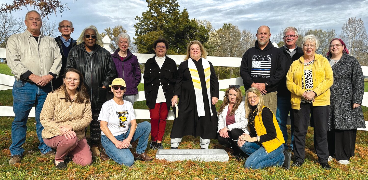 Kneeling left to right: Fayette City Clerk Judy Thompson, and Alderwomen Bekki Galloway, Stephanie Ford, and Michelle Ishmael. Standing: Danny Dougherty (Public Works Director), Gary Bagby (Cemetery Association), Regina Powell (Community Activist), Pansy Kean (Citizen Activist), Alderwoman Ronda Gerlt, Pastor Kerry Kesey, City Marshal David Ford, Mike Dimond (Assistant to the Mayor of Fayette), Pam Huttsell (Fayette Historic Preservation Commission Chair), and MoDOT Archeologist Brianne Greenwood.