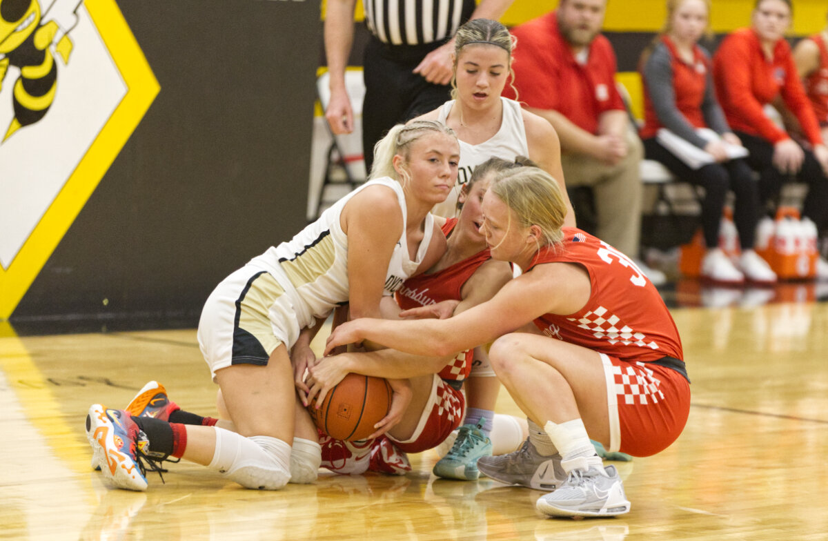 Cairo and Harrisburg players fight over a loose ball.