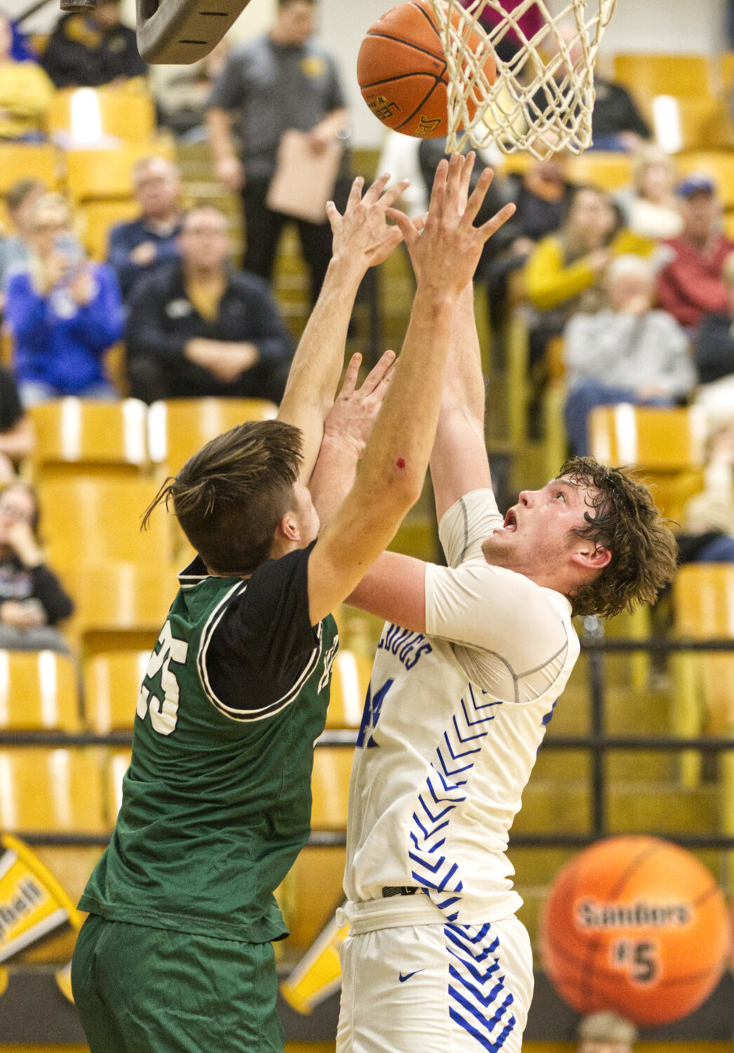 New Franklin senior Connor Wilmsmeyer goes up for a contested shot against Westran junior Marshall Kitchen.