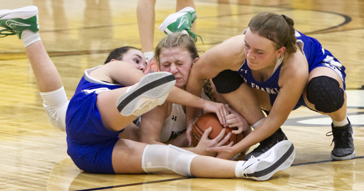 Scrappy New Franklin and Westran players fight after a loose ball.