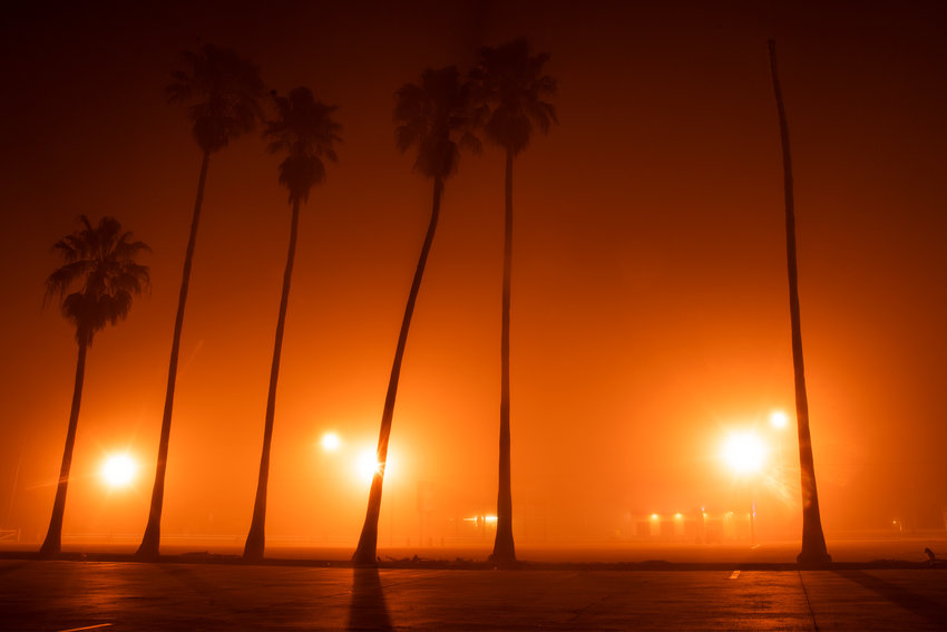 Fog envelopes the street lights in front of the Brahman theater on the morning of Feb. 9.