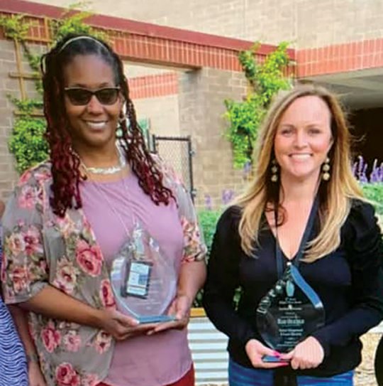 Two Glades Central High School teachers, Carla Little-Griffiths and Mari Orsengio, received William T. Dwyer Awards for Excellence in Education,