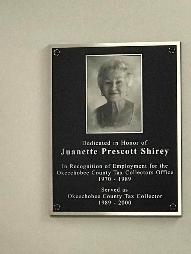 A plaque honors Juanette Shirey for her service to the tax collector's office from 1970 to 2000.