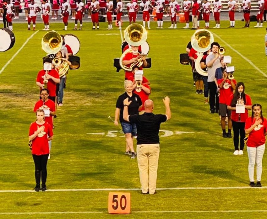 MOORE HAVEN -- Glades County Superintendent of Schools Beth Browning Barfield joined the marching band on Oct. 8, to twirl a baton.