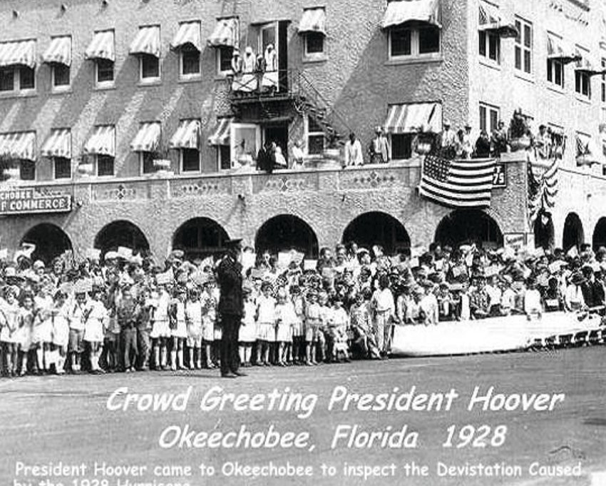1928 President Herbert Hoover visits Okeechobee. The building in the background is the Southland Hotel,