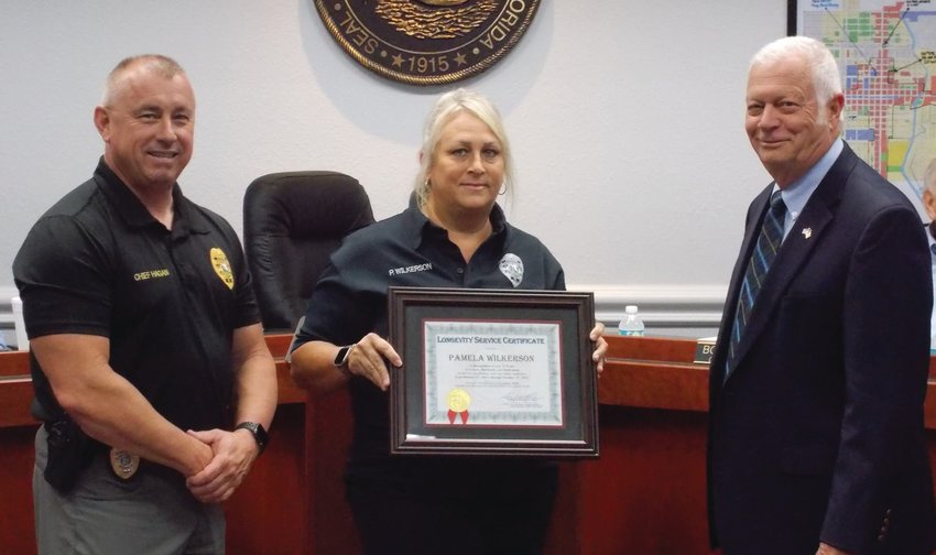 Police Chief Hagan & Mayor Watford presented Dispatcher Pam Wilkerson with a 10 year longevity service award. Pictured left to right: Police Chief Donald Hagan, Dispatcher Pam Wilkerson, Mayor Dowling Watford