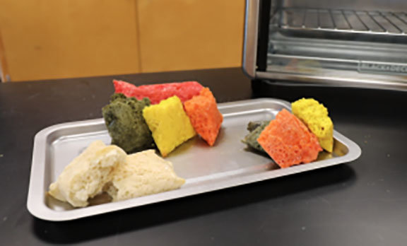 Loaves of space bread gain color by various nutritional elements added to the ingredients.