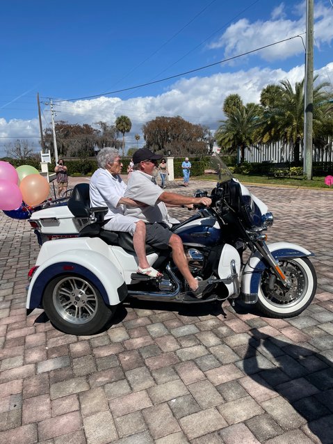 Larry Davis chauffeurs Mable Spangler to her 100th birthday party.