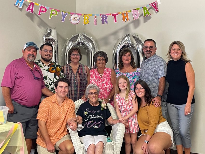 Mable Spangler is surrounded by family at her 100th birthday party.