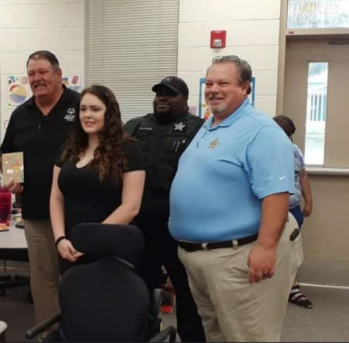 When a local child needed a very expensive specialized wheelchair, Sheriff Noel Stephen (right) Bernard Marker (left) and Ashley Marker went to work raising money.