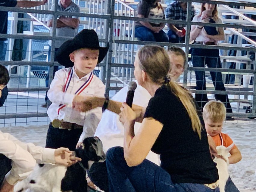 LABELLE -- Pee Wee goat Judge Kimberly Kemp shakes the hand of a young exhibitor.