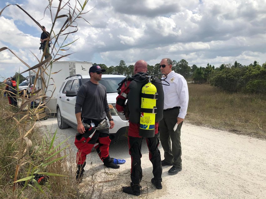 Martin County Fire Rescue divers searched canals on Hungryland Preserve after a human hand and arm were recovered from a canal bank near alligators.